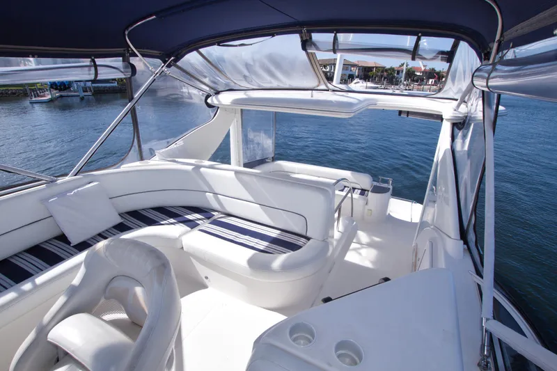 Slide: The Image of 2007 Meridian 459 Motoryacht interior with luxurious seating and waterfront view. - 37