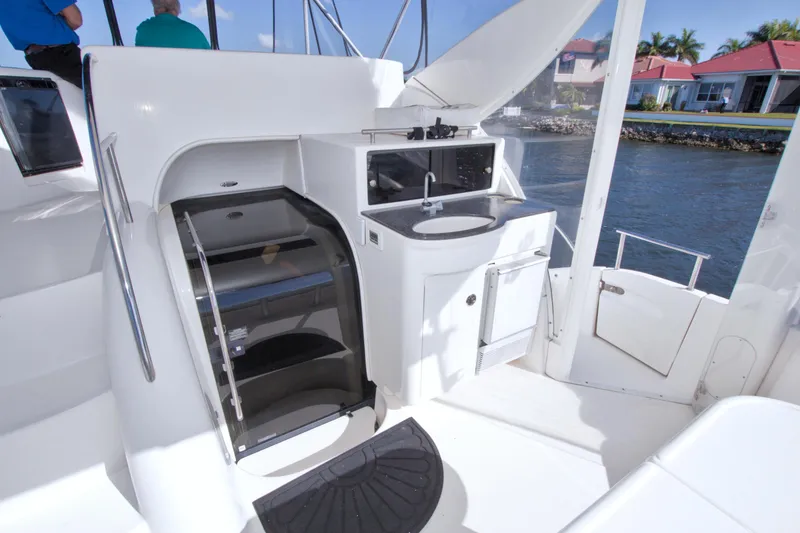 Slide: The Image of 2007 Meridian 459 Motoryacht interior with sink, stairs, and water view. - 39