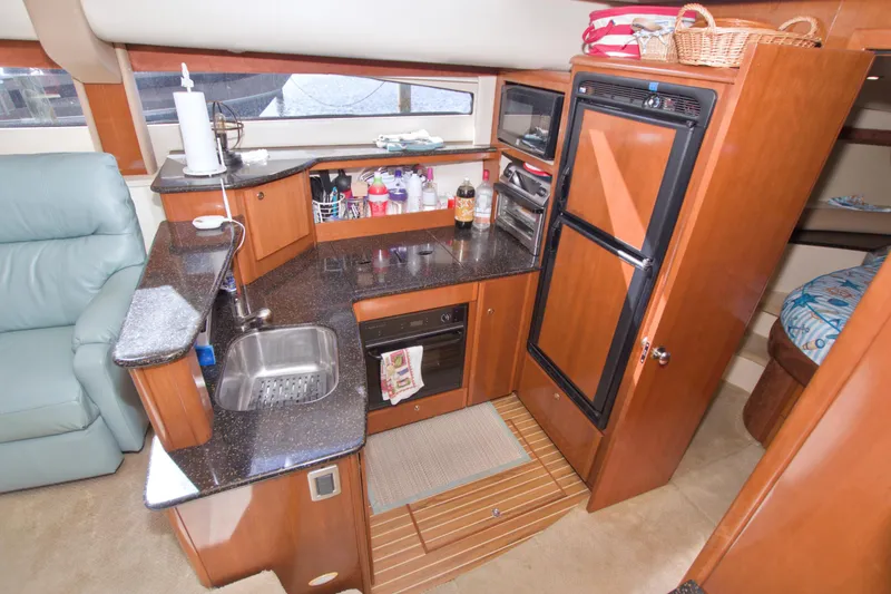 Slide: The Image of Luxurious 2007 Meridian 459 Motoryacht kitchen with modern amenities and sleek design. - 46