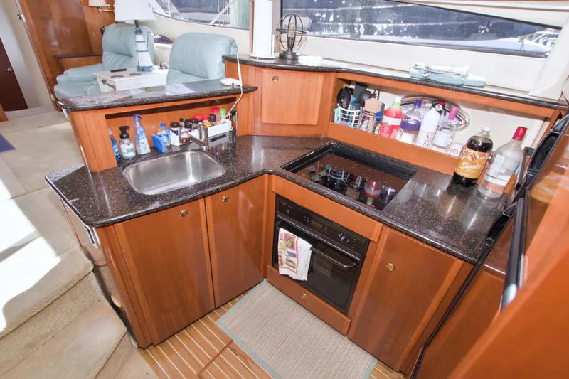Slide: The Image of Luxurious 2007 Meridian 459 Motoryacht kitchen with modern amenities and sleek design. - 47