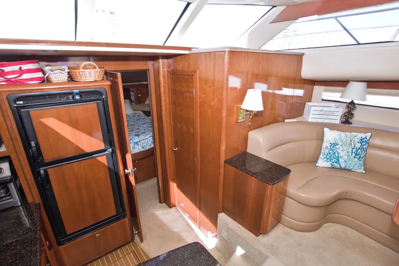 Slide: The Image of Luxurious interior of 2007 Meridian 459 Motoryacht with elegant wood finishes and cozy seating. - 48