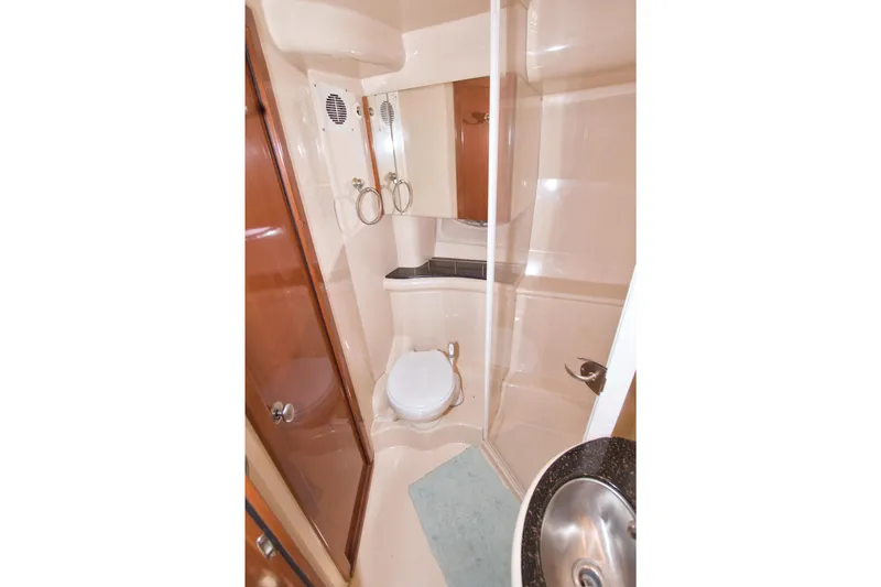 Slide: The Image of 2007 Meridian 459 Motoryacht bathroom with shower, toilet, and sink. - 55