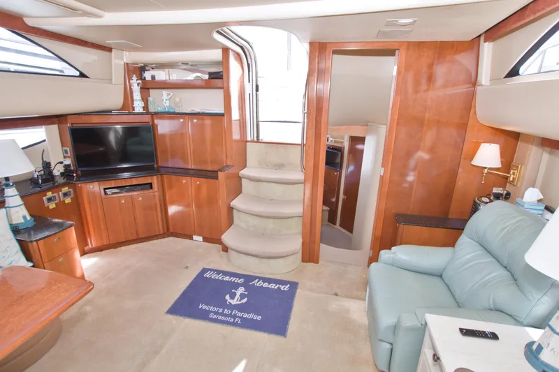 Slide: The Image of Luxurious interior of 2007 Meridian 459 Motoryacht with elegant wood finishes and cozy seating. - 60