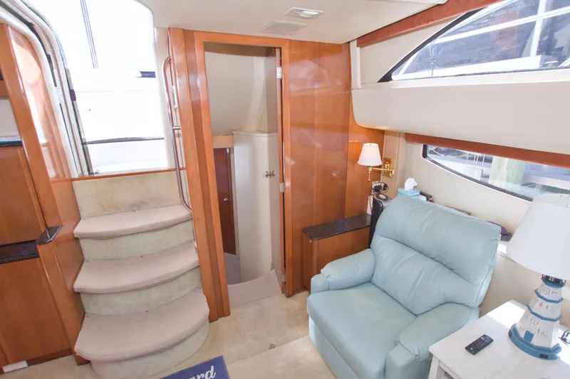 Slide: The Image of Interior of 2007 Meridian 459 Motoryacht with stairs, armchair, and wooden cabinetry. - 61