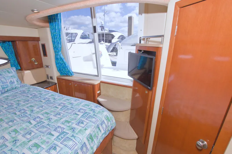 Slide: The Image of Luxurious 2007 Meridian 459 Motoryacht bedroom with window view and TV. - 64