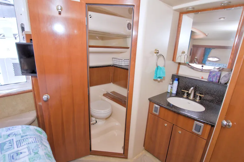 Slide: The Image of Luxurious bathroom in 2007 Meridian 459 Motoryacht with wood cabinetry and modern fixtures. - 70