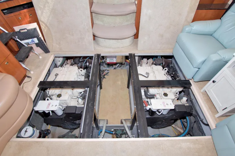 Slide: The Image of Engine room of 2007 Meridian 459 Motoryacht, showcasing dual engines and interior layout. - 74