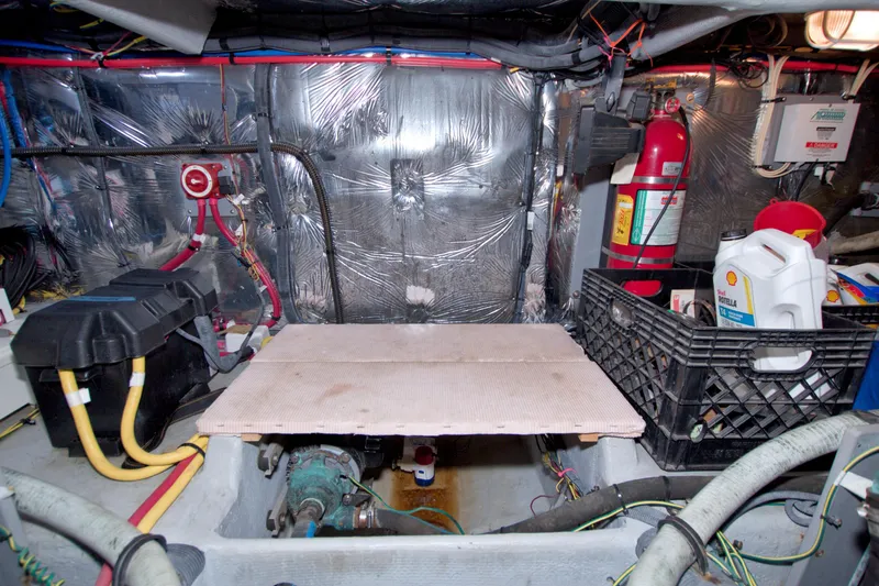 Slide: The Image of Engine room of a 2007 Meridian 459 Motoryacht with equipment and storage. - 80