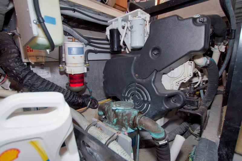 Slide: The Image of Engine room of 2007 Meridian 459 Motoryacht, showcasing mechanical components and filters. - 83