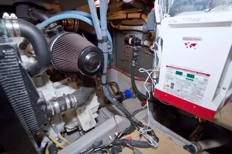 Slide: The Image of Engine room of 2007 Meridian 459 Motoryacht with visible components and wiring. - 87