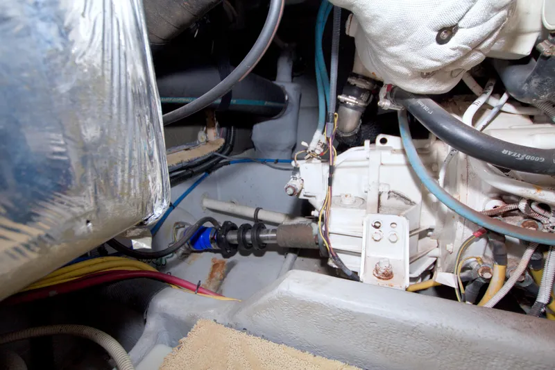 Slide: The Image of Engine compartment of a 2007 Meridian 459 Motoryacht, showcasing mechanical components and wiring. - 89