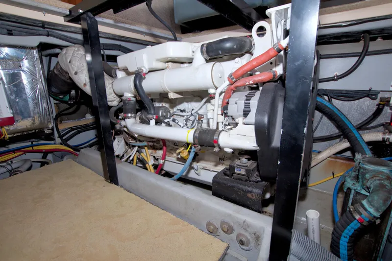 Slide: The Image of Engine room of 2007 Meridian 459 Motoryacht, showcasing mechanical components and wiring. - 90