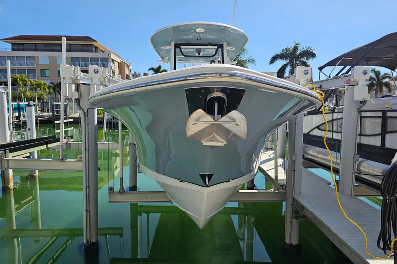 Slide: The Image of 2021 Sea Hunt Gamefish 27 Forward Seating boat docked at marina. - 10