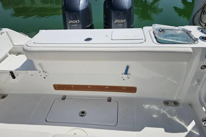 Slide: The Image of 2021 Sea Hunt Gamefish 27 boat with dual Yamaha 200 engines, featuring forward seating. - 18