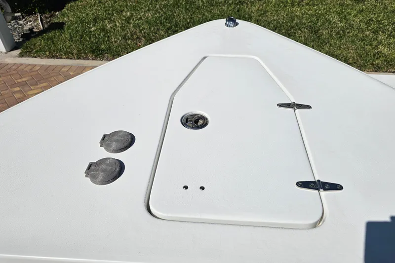 Slide: The Image of 2021 Sea Hunt Gamefish 27 Forward Seating boat deck with hatch and fittings. - 23