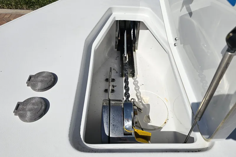 Slide: The Image of Anchor compartment of 2021 Sea Hunt Gamefish 27 Forward Seating boat. - 24