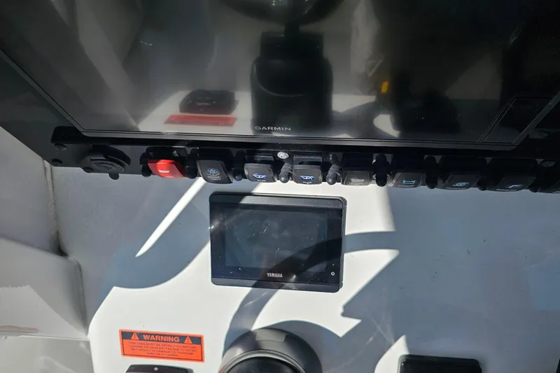 Slide: The Image of Control panel of 2021 Sea Hunt Gamefish 27 with Garmin and Yamaha displays. - 33