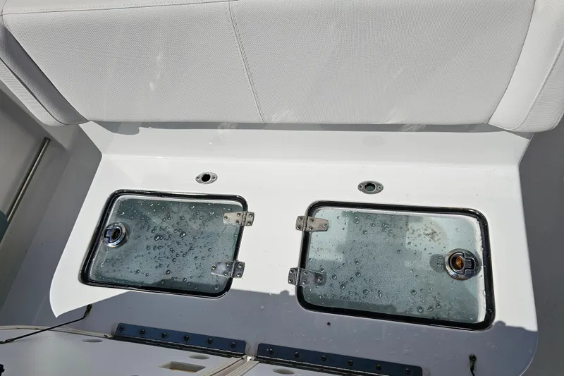 Slide: The Image of 2021 Sea Hunt Gamefish 27 Forward Seating livewell compartments with water droplets. - 37