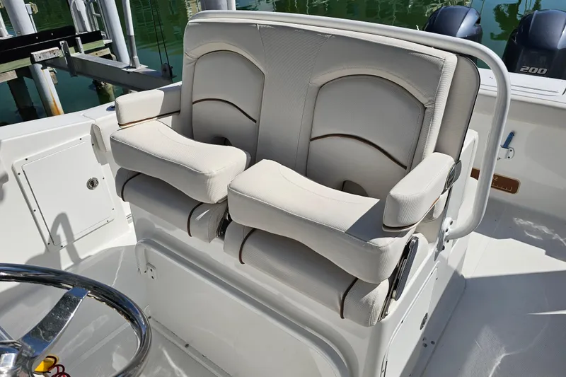 Slide: The Image of 2021 Sea Hunt Gamefish 27 boat seating with dual cushioned chairs and armrests. - 40