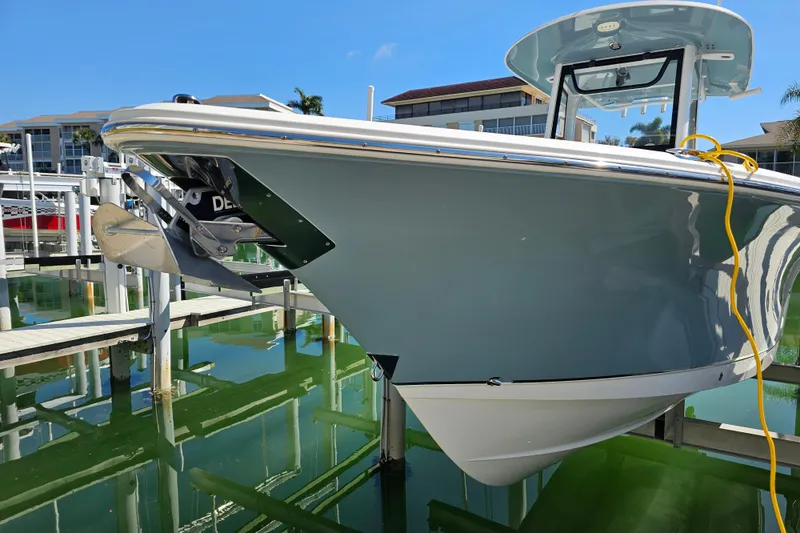 Slide: The Image of 2021 Sea Hunt Gamefish 27 Forward Seating boat docked in marina. - 9