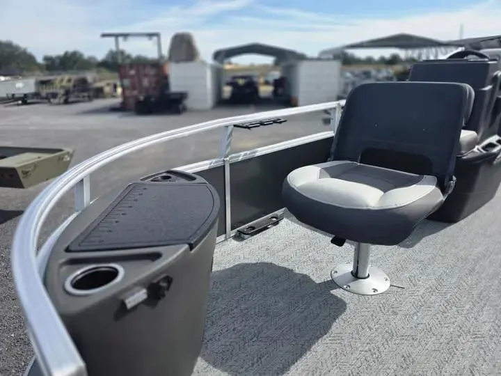 Slide: The Image of 2026 Sun Tracker Bass Buggy 18 DLX with seat and cup holder. - 11