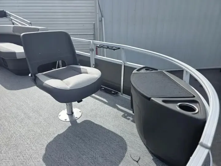 Slide: The Image of 2026 Sun Tracker Bass Buggy 18 DLX pontoon boat with seating and storage. - 12