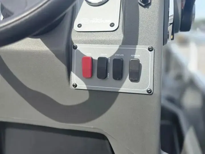 Slide: The Image of Control panel of Sun Tracker Bass Buggy 18 DLX 2026. - 17