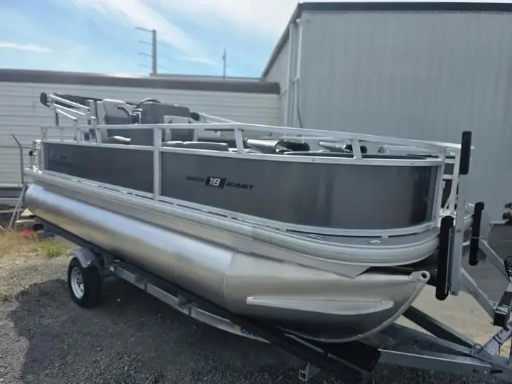 Slide: The Image of 2026 Sun Tracker Bass Buggy 18 DLX parked on trailer. - 9