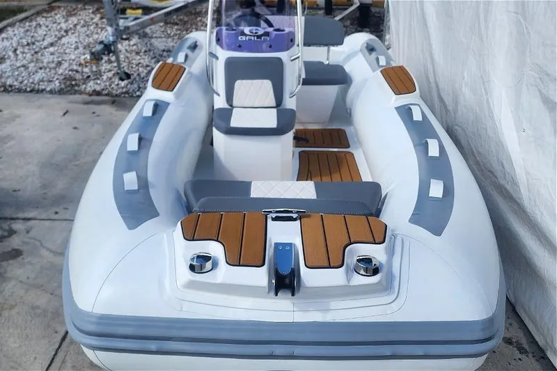 Slide: The Image of 2025 Gala A400L inflatable boat with wood accents and modern seating design. - 3