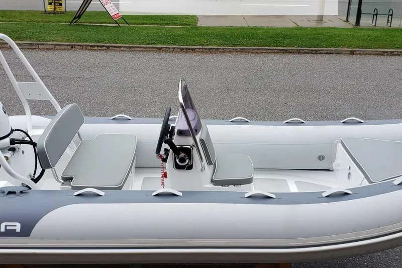 Slide: The Image of Gala A400L 2025 inflatable boat with gray seats and steering console. - 8