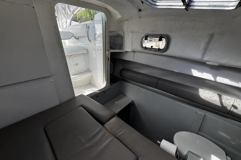 Slide: The Image of Interior of 2001 Glacier Bay 260 Canyon Runner boat, featuring seating and compact design. - 29