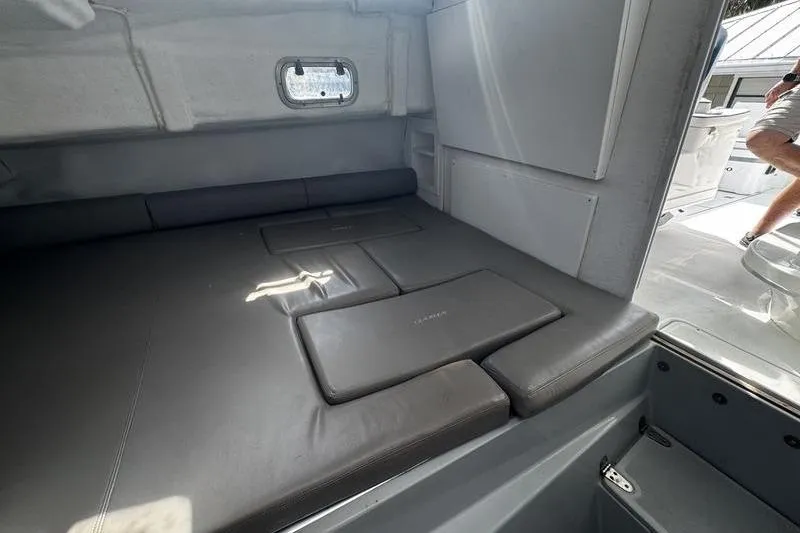 Slide: The Image of Interior cabin of 2001 Glacier Bay 260 Canyon Runner boat with cushioned seating. - 31