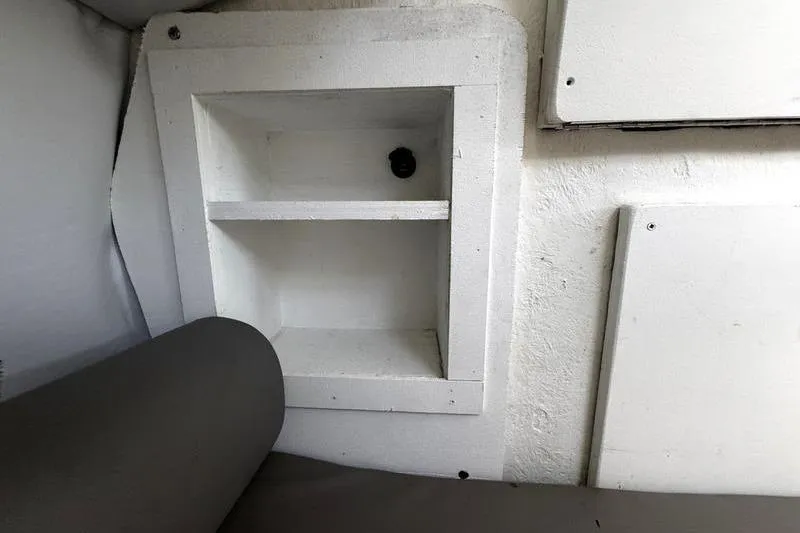 Slide: The Image of Interior storage shelf in 2001 Glacier Bay 260 Canyon Runner boat. - 32
