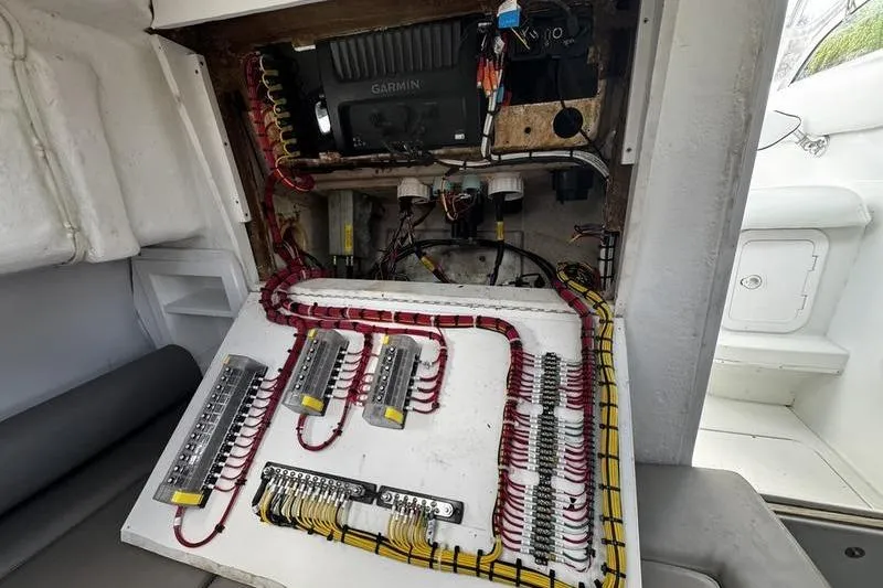 Slide: The Image of Electrical panel of 2001 Glacier Bay 260 Canyon Runner boat with organized wiring and Garmin device. - 42