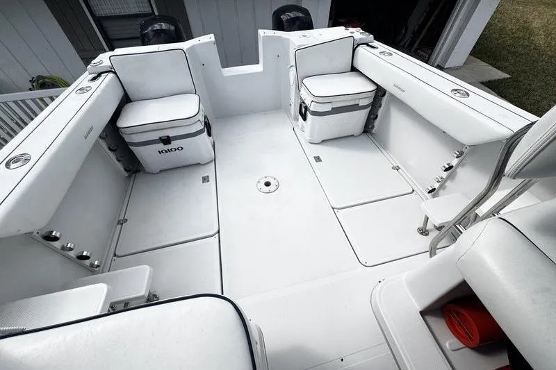 Slide: The Image of 2001 Glacier Bay 260 Canyon Runner boat interior with seating and storage compartments. - 46