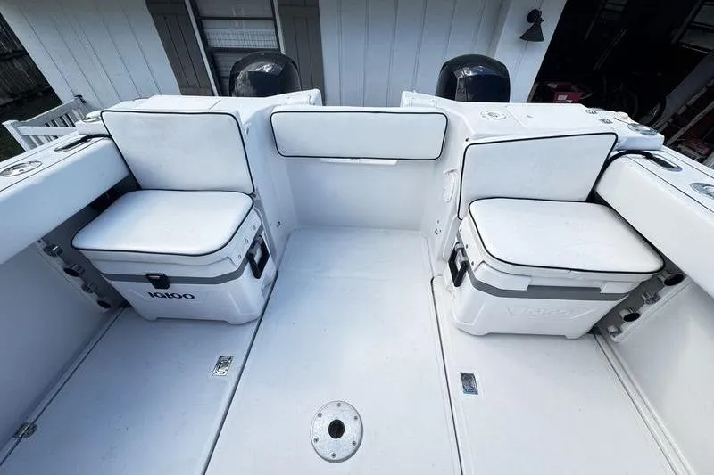 Slide: The Image of 2001 Glacier Bay 260 Canyon Runner boat interior with seating and storage compartments. - 49