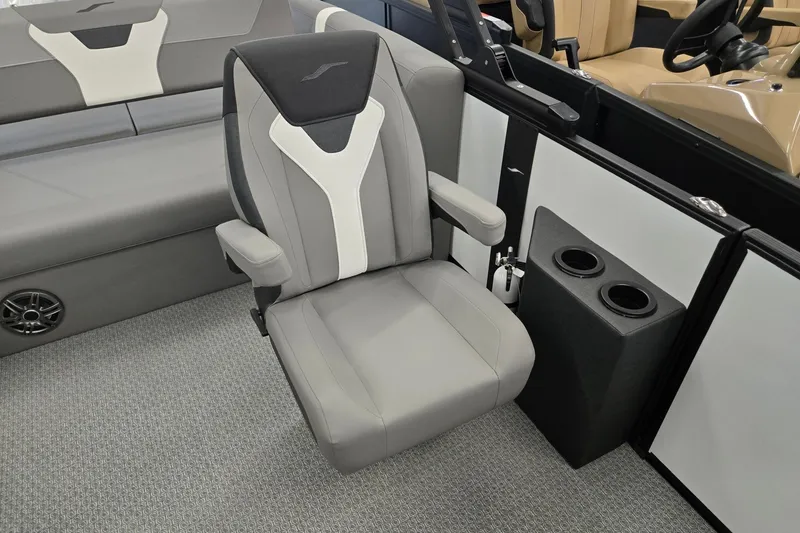 Slide: The Image of Gray captain's chair in 2026 Evotti 521CS boat interior with cup holders. - 10