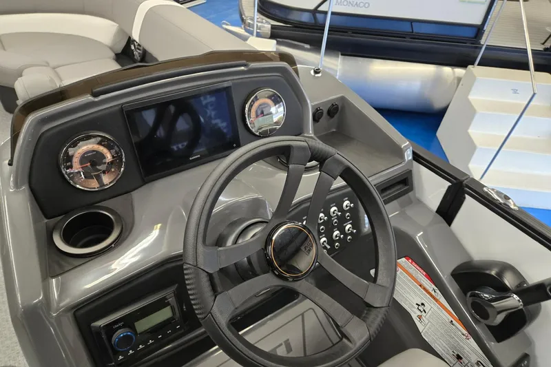 Slide: The Image of Steering console of 2026 Evotti 521CS boat with modern dashboard and controls. - 12