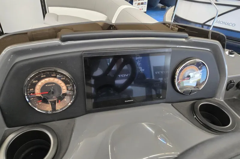 Slide: The Image of Dashboard of 2026 Evotti 521CS boat with Garmin display and gauges. - 13
