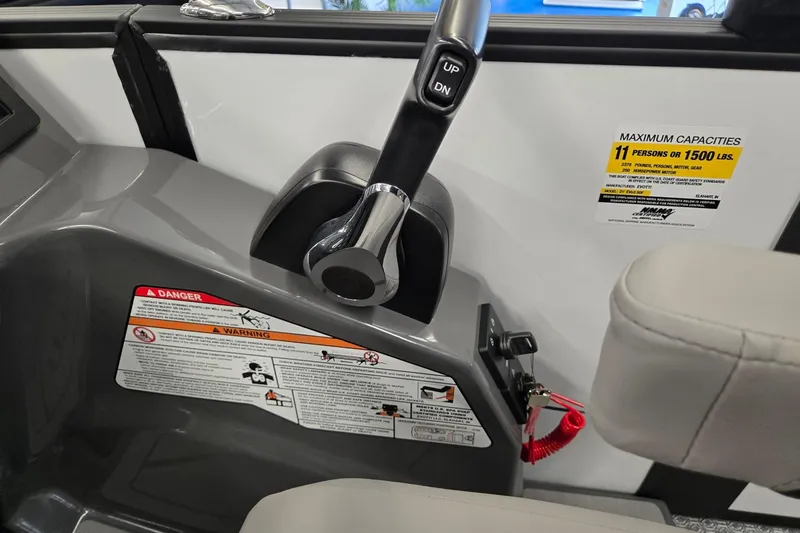 Slide: The Image of Control panel of 2026 Evotti 521CS boat with capacity and safety warnings. - 16