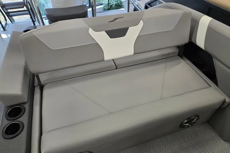 Slide: The Image of Gray seating area in a 2026 Evotti 521CS boat with cup holders and modern design. - 18