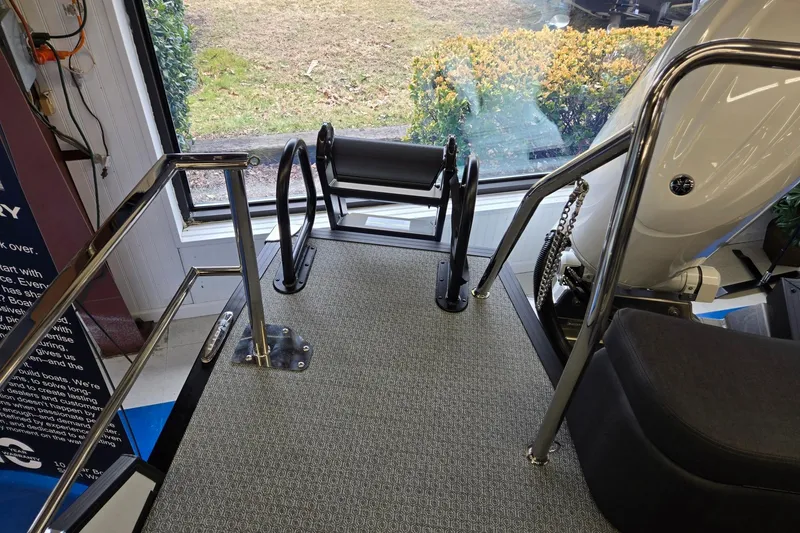 Slide: The Image of Interior of 2026 Evotti 521CS boat with stainless steel railings and carpeted flooring. - 20