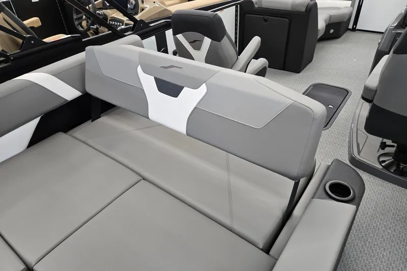 Slide: The Image of 2026 Evotti 521CS boat interior with gray seating and cup holders. - 23