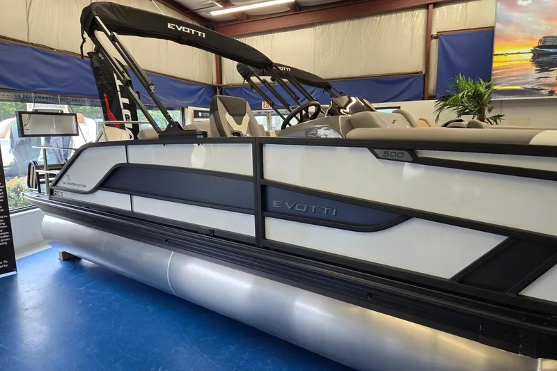 Slide: The Image of 2026 Evotti 521CS pontoon boat displayed indoors, featuring sleek design and modern seating. - 3