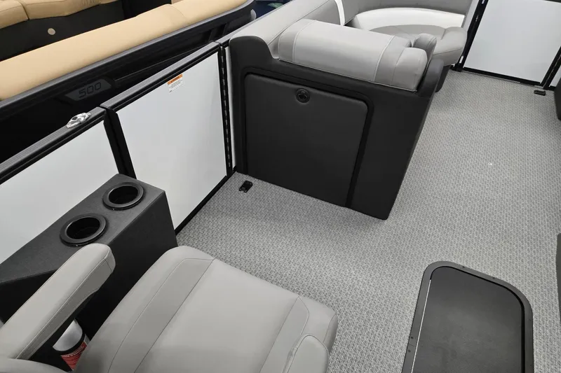 Slide: The Image of Interior of 2026 Evotti 521CS boat with gray seating and cup holders. - 30