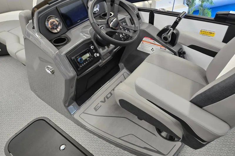 Slide: The Image of Cockpit of 2026 Evotti 521CS boat with modern controls and comfortable seating. - 31