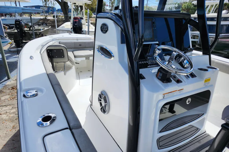 Slide: The Image of 2022 Sea Pro 259 Deep V CC boat interior with steering console and seating. - 11