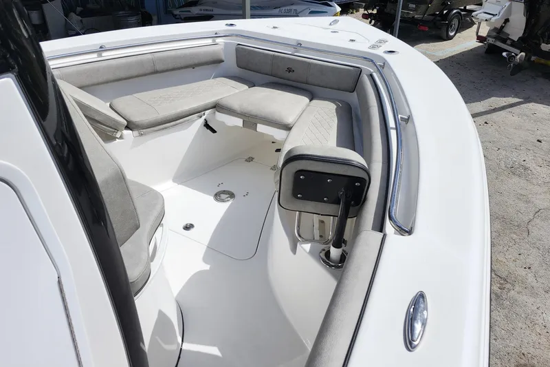 Slide: The Image of 2022 Sea Pro 259 Deep V CC boat interior with cushioned seating and sleek design. - 15