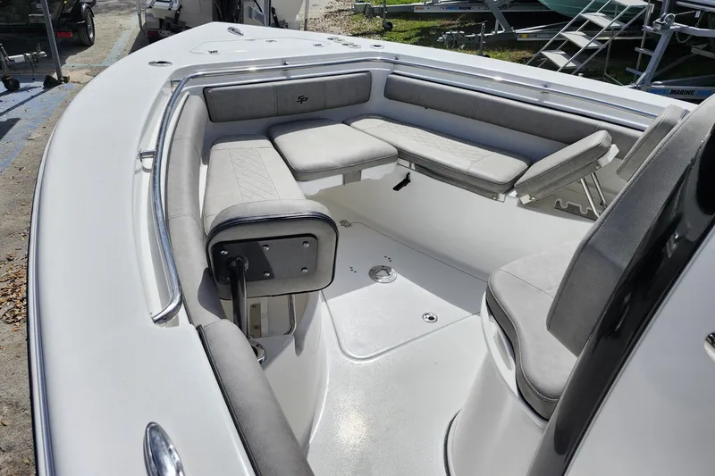 Slide: The Image of 2022 Sea Pro 259 Deep V CC boat interior with cushioned seating and sleek design. - 16