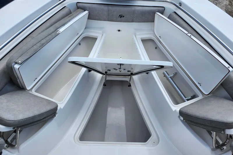 Slide: The Image of 2022 Sea Pro 259 Deep V CC boat interior with open storage compartments. - 17